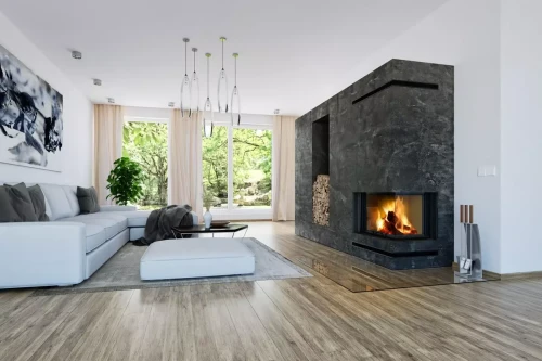 Kominek stalowy Romotop Heat R 3G L 81.51.40.24 narożny prawy z gilotyną w pięknej aranżacji.webp